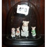 Victorian glass display dome containing miniature porcelain pigs at school!