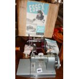 Two vintage sewing machines - the Vulcan and The Essex miniature sewing machine with instructions