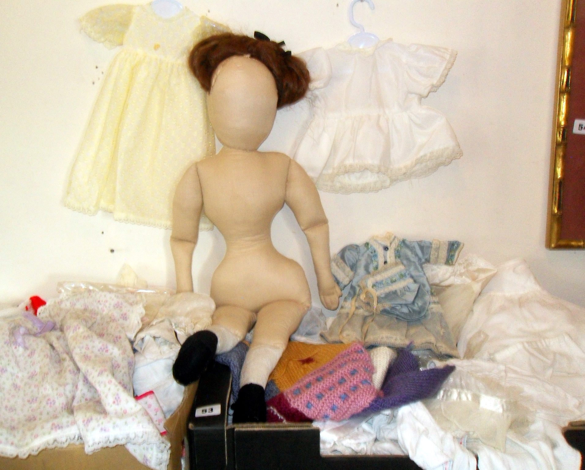 Large soft doll and two big boxes of assorted dolls clothes