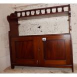 Late Victorian mahogany wall shelf with two cupboards, doors and turned gallery