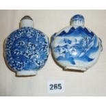 Two large Chinese porcelain blue and white snuff bottles, one decorated with dragons, the other with