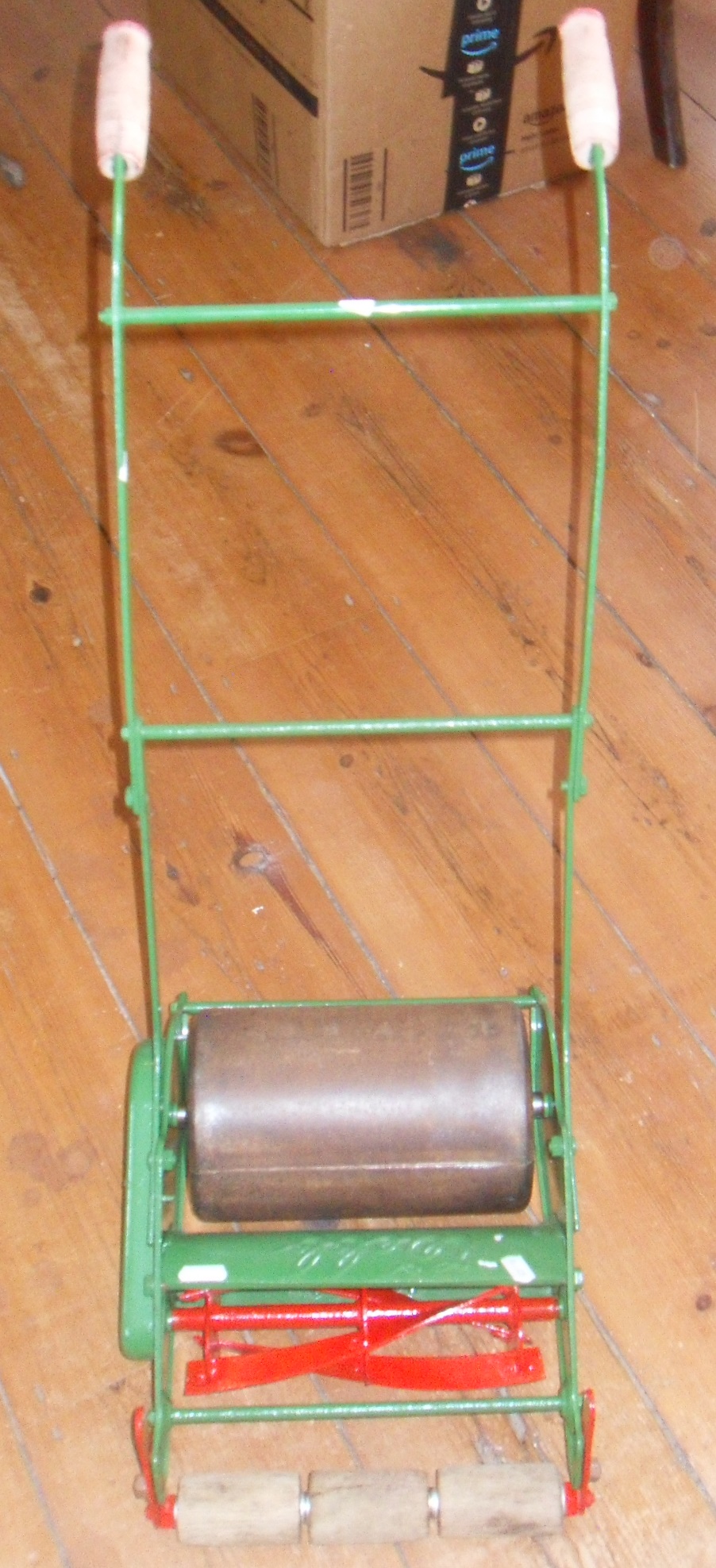 A vintage Webb child's toy lawn mower