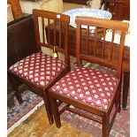 Pair of 19th c. mahogany dining chairs with top rail above stick splats and upholstered drop in