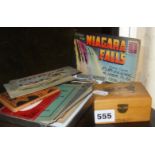 Assorted novelty and silk postcards and a Mauchline Ware box