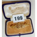 Victorian 15ct gold bar pendant brooch set with stone and in original Henry & Peck case
