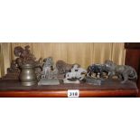 Early 19th c. spelter, iron and lead ornaments, inc. lions, horses, etc., and inc. a pewter measure