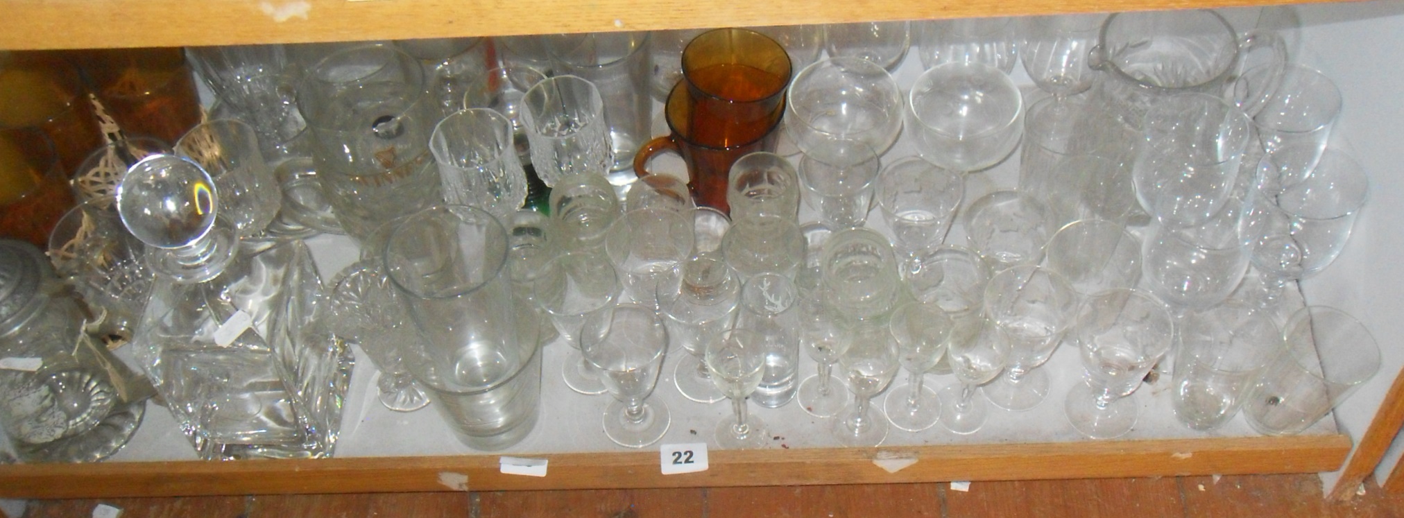 Large quantity of cut glass drinking glasses and decanters