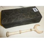 Tribal Art: Dark wood box carved with leaves and fruit and an antique 19th c. carved ivory handle or