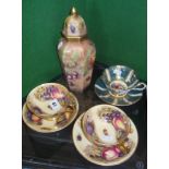 Pair Aynsley china tea cups and saucers with fruits decoration, a similar lidded vase hand painted