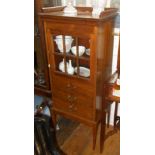 Late 19th c. mahogany cabinet having galleried top with glazed single door above three drawers