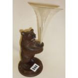 Early 20th c. carved Black Forest bear holding an etched glass epergne vase, approx 9" high