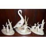 Pair of Nao Lladro swan ornaments and another larger by Casades