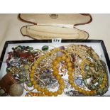 Collection of costume jewellery, badges, vintage faux pearls etc.