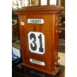 Large early 20th c. mahogany cased wall calendar