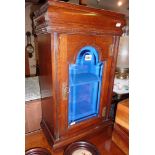Victorian oak wall cabinet with arch topped bevelled glass door