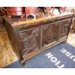 18th c. carved oak coffer, 4' wide x 28" high x 20" deep, having three carved panels to front with