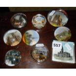 Nine various souvenir glass paperweights