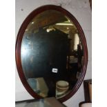 Oval mahogany framed wall mirror