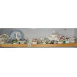 Shelf of assorted floral decorated china and china flower ornaments, etc.
