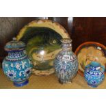 Three Iznik pottery vases, a similar bowl and a continental pottery charger with fish decoration,