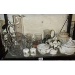 Shelf of assorted china and glass inc. feeding cup, Quimper style pot and cut glass water jug, etc.