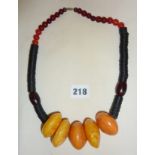 Tribal Art: Dogon style necklace with large amber? beads x 5 (beads approx 1.5" in diameter)