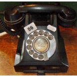 Old black bakelite telephone with Netherbury exchange