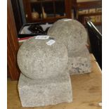 Pair of small stone spherical gate post finials