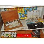 Shelf of artist's materials, inc. Reeves watercolour boxes, wooden artist's palette, etc.