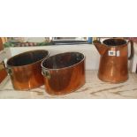 Pair of copper planters and a copper water jug