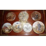 Seven pictorial pot lids on a Chinese teak and brass tray