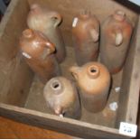 Wooden box containing old stoneware gin bottles