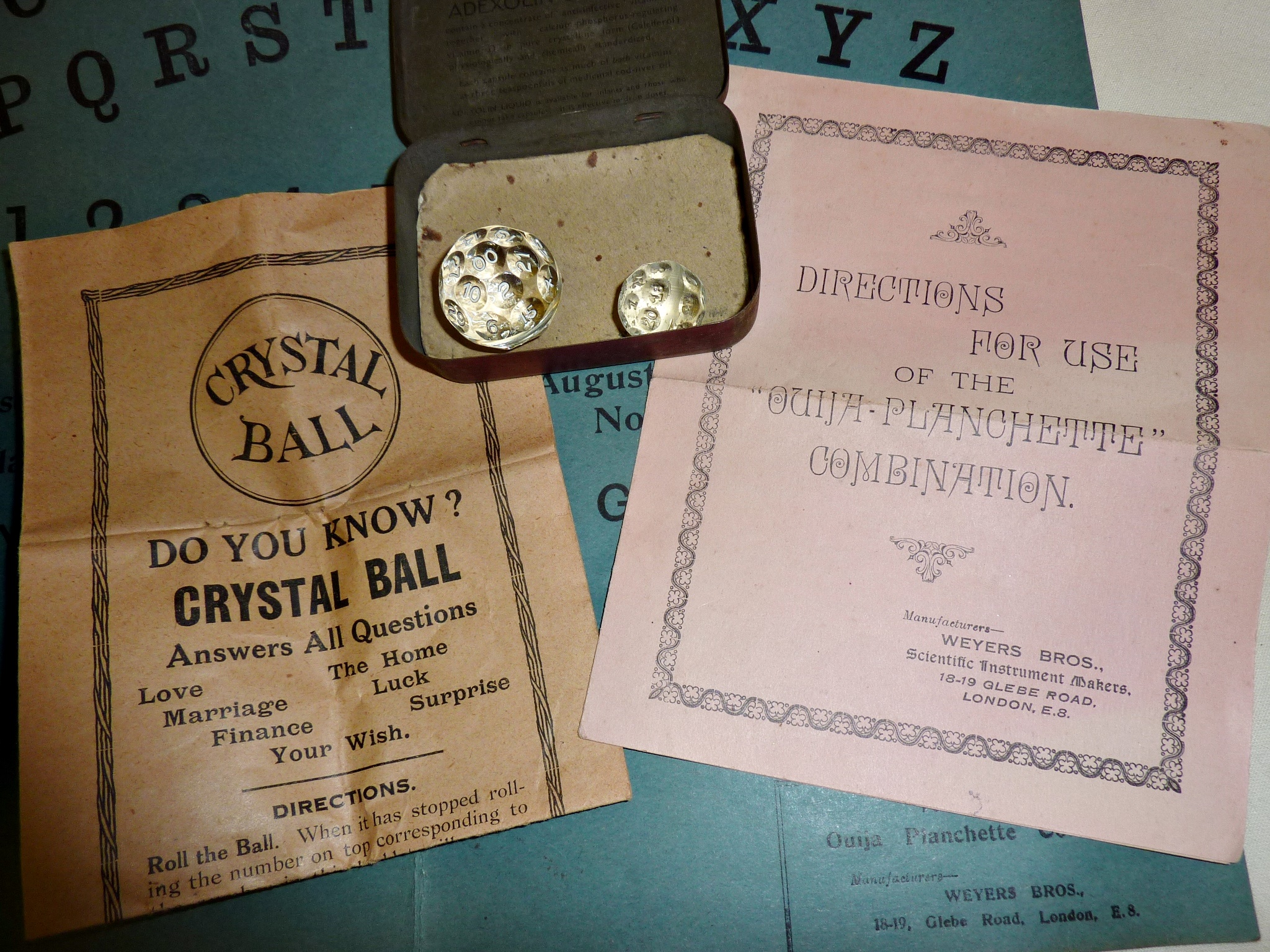 Rare 1920s card Ouija board with wooden planchette and directions leaflet, together with two faceted - Image 2 of 2