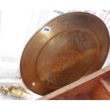 Large Oriental brass tray (57cms diameter). together with an Eastern brass chamberstick (A/F) and