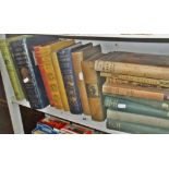 Shelf of old hardback books