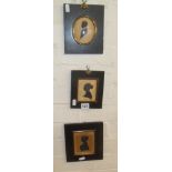 Three Victorian silhouettes in ebonised frames