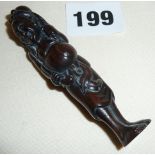 Japanese rosewood carved netsuke of man with octopus on his head, ivory tablet signed under foot