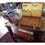 An Adana Five-Three printing press with four cases of typefaces