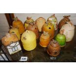 Collection of ten various lidded ceramic honey pots, honeycomb and beehives