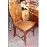 19th c. hall chair with oval solid back standing on square tapering legs