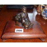 Japanese bronze figure of a seated woman on a wood plinth