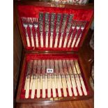 Victorian canteen of 18 settings of tea knives and forks with engraved blades and decorative