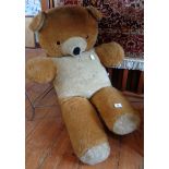Large stuffed toy bear and quantity of old tins