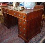 Victorian mahogany nine-drawer kneehole desk with tooled brown leather top