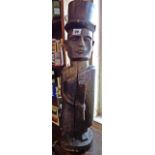 Old African carved wood figure of a European in a top hat