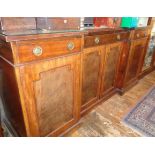 Late Victorian mahogany breakfront sideboard having three drawers above panelled doors