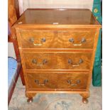Walnut-veneered bedside chest of three drawers