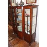 Edwardian inlaid mahogany china cabinet having two glazed doors flanking a central bow-fronted