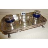 Silver plated desk inkwell stand with blue glass inkwells and galleried rim