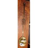 An 18th c. brass ladle with fig shaped bowl and an 18th c. polished steel fork